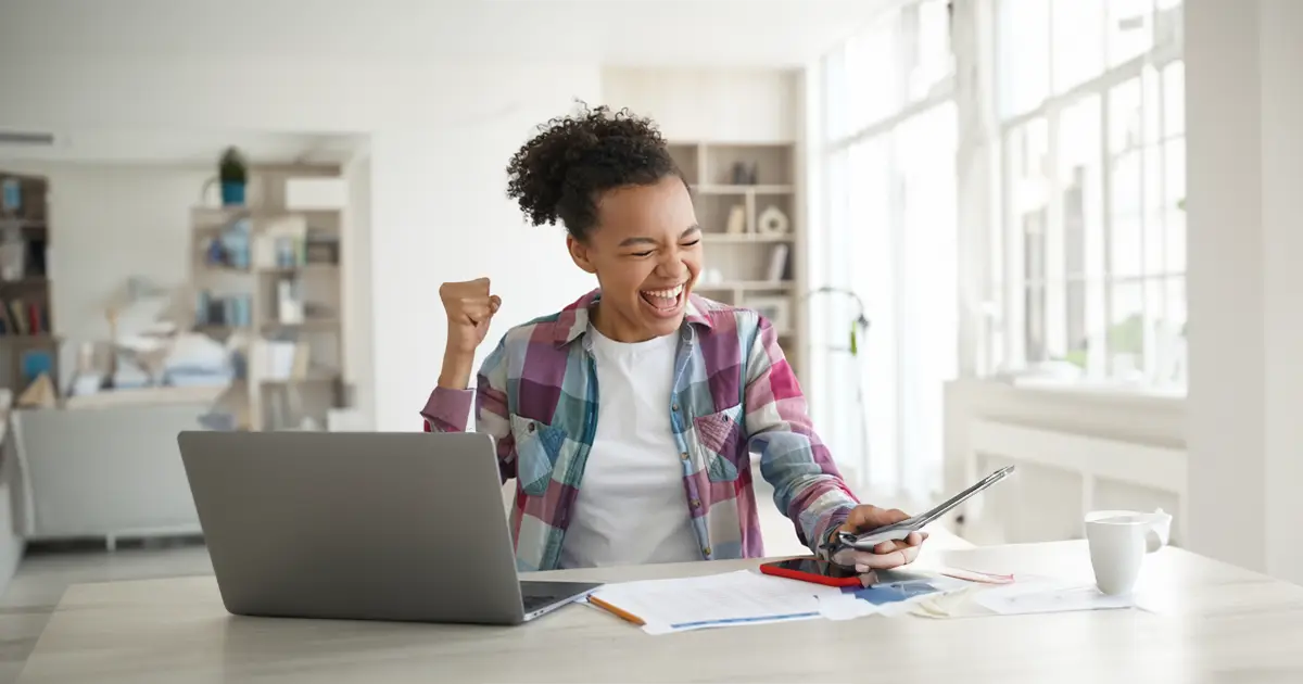 a woman taking control of her financial destiny, cheering