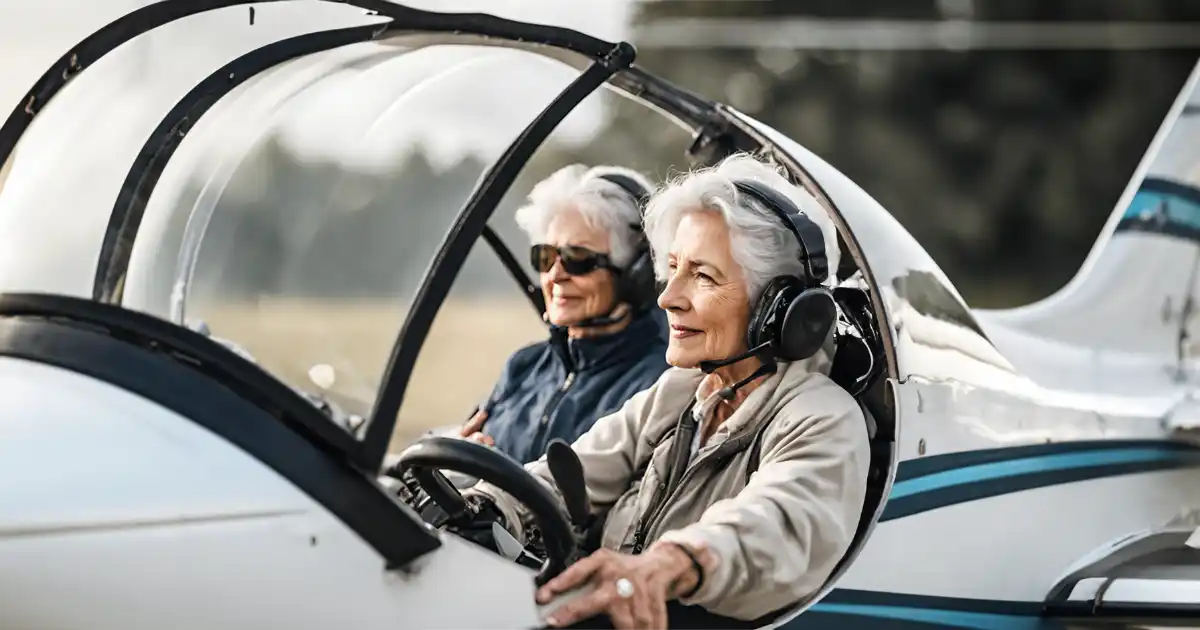 Two mature woman sitting in the cockpit of a small aircraft