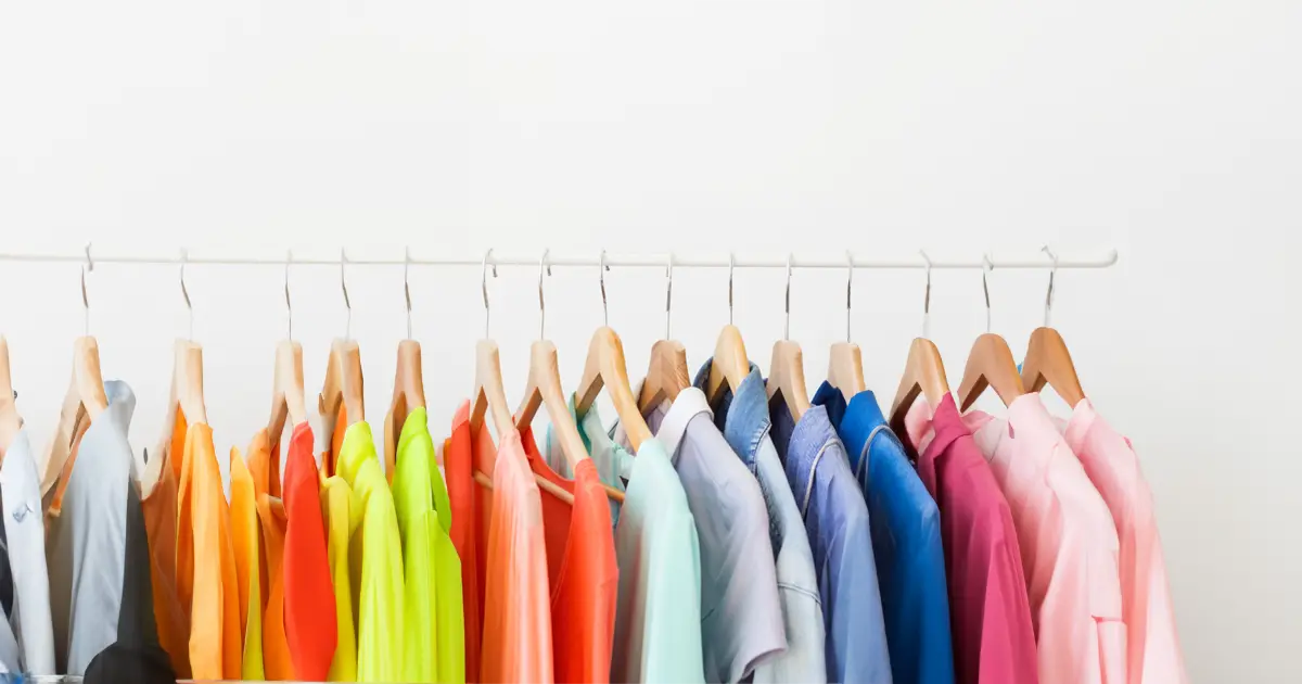 Rack of clothing in different colours