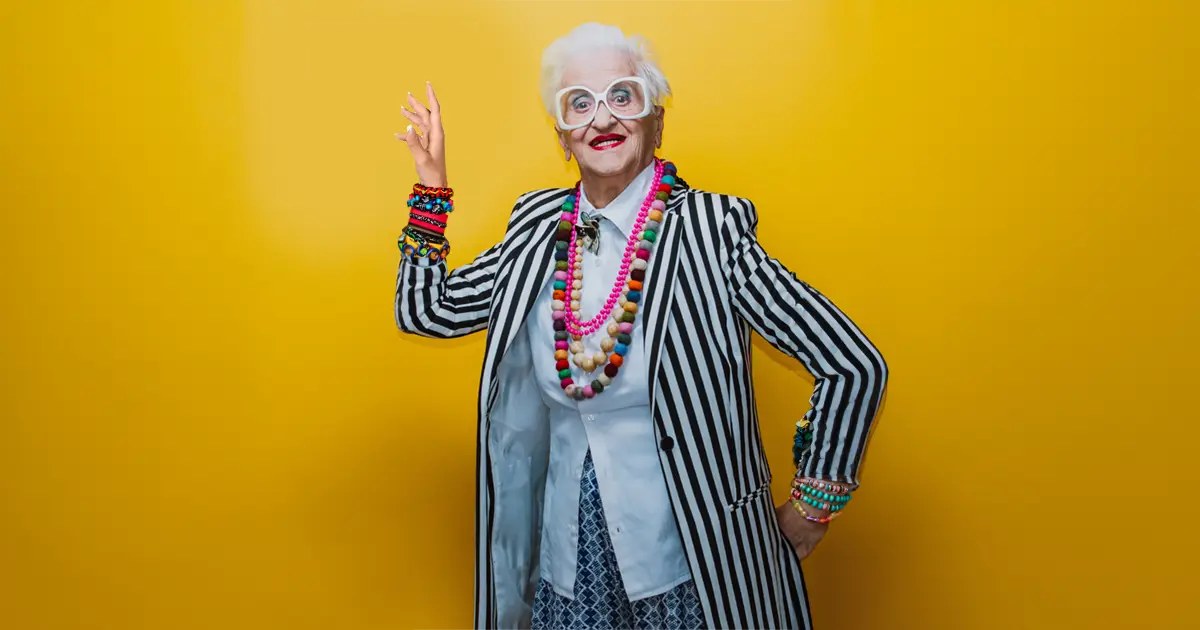 Woman in stripped jacket wearing colourful accessories