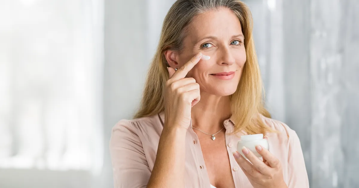 woman applying face cream