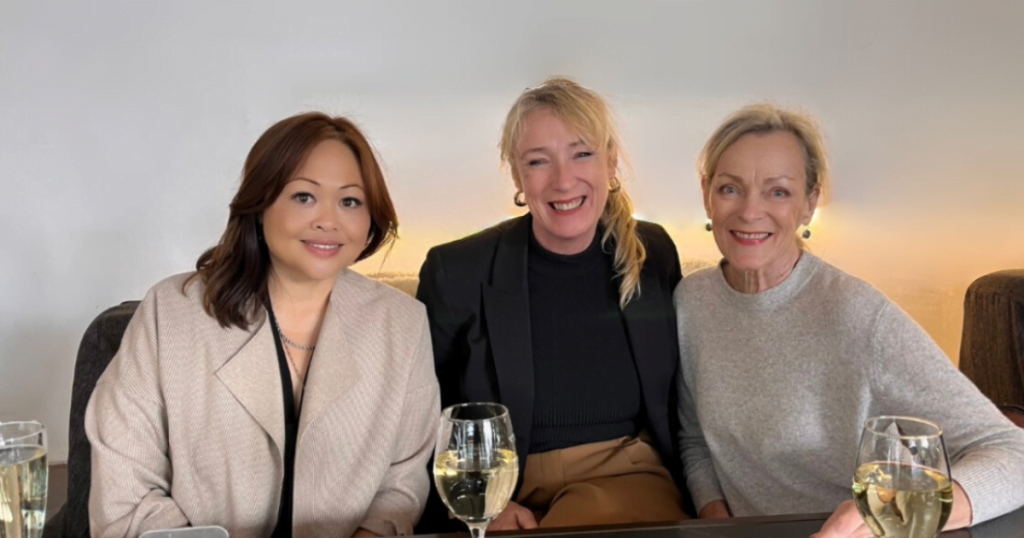 Alexis, Caroline and Annie enjoying a glass of wine together.