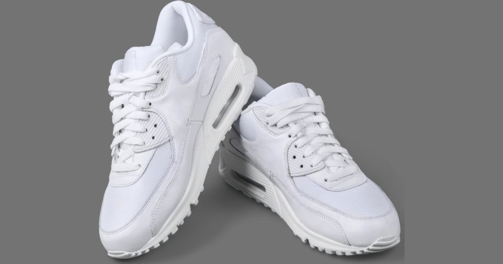 A pair of white non-branded sneakers.