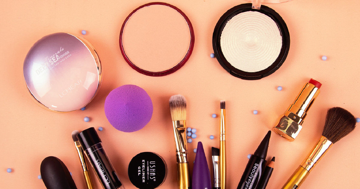 An assortment of makeup and brushes women use for beauty.